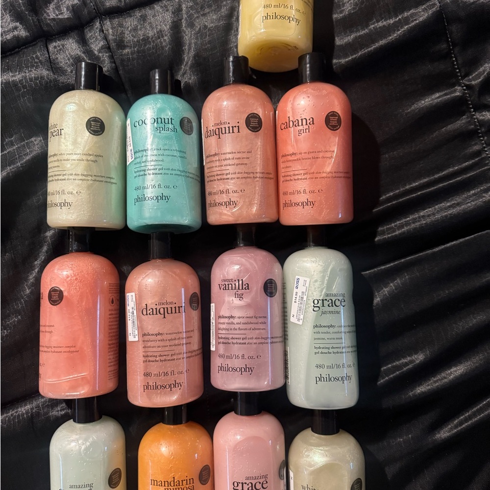 13 Philosophy assorted body washes in pink, teal, coral, peach, cream, yellow.